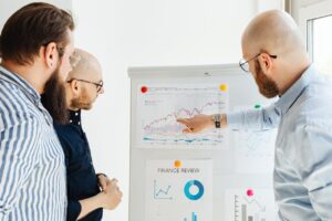Estate planner informing two clients about a change in their plan